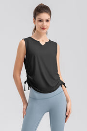 Black active tank top with notched neckline and adjustable side ruching detail.