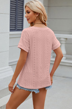 Blush pink perforated tee with rolled sleeves and a casual fit.