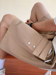 Men's camel cargo shorts with drawstring and snap button details.
