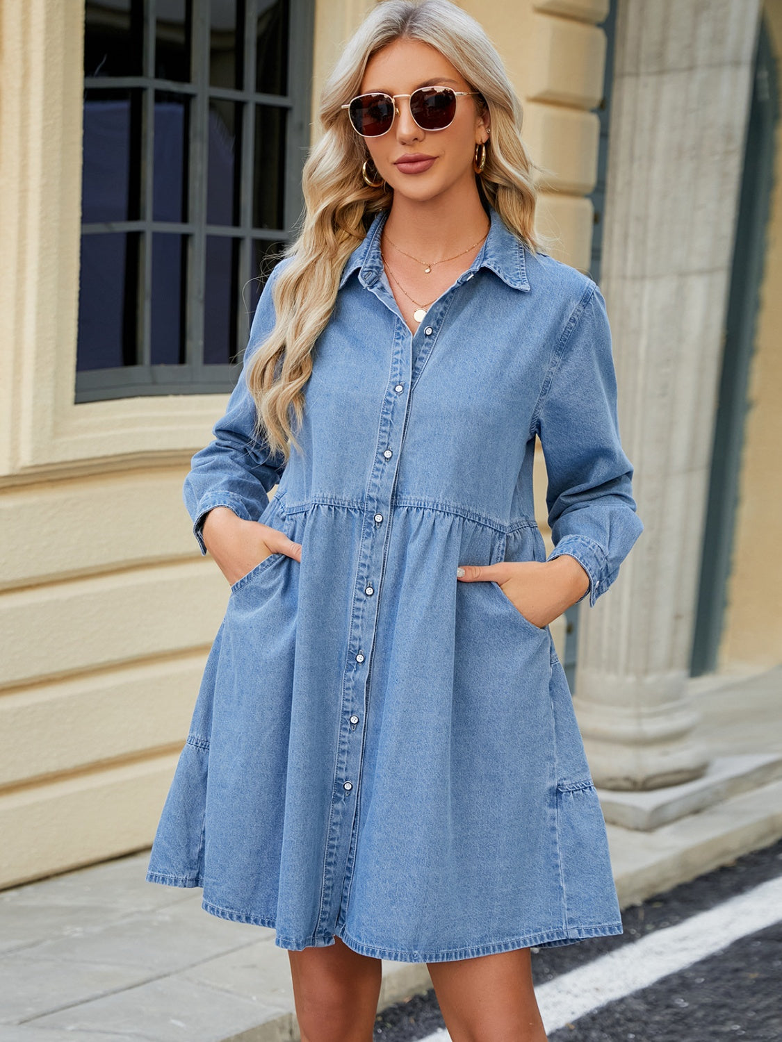 Tiered denim shirtdress in medium wash with button front, collar, long sleeves, and pockets.