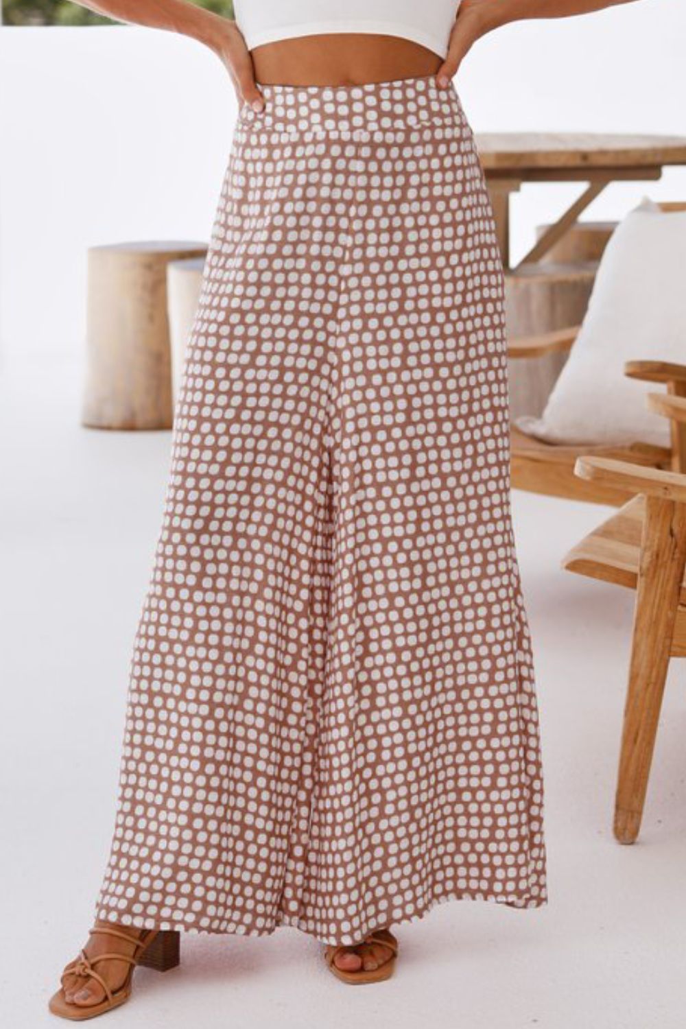 Brown polka dot wide leg culottes with a high waist.