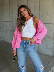 Textured boxy utility shirt jacket in fuchsia pink with button front and casual fit.