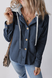 French blue corduroy shirt jacket with contrast hood and button front, featuring chest pockets.