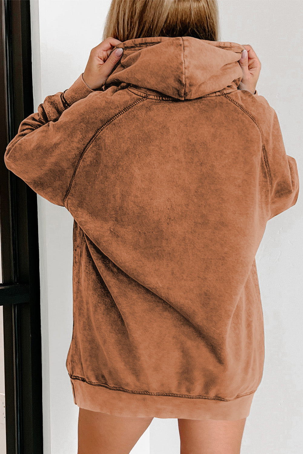 Textured raglan sleeve hoodie in a washed rust color with a relaxed fit and drawstring hood.