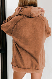 Textured raglan sleeve hoodie in a washed rust color with a relaxed fit and drawstring hood.