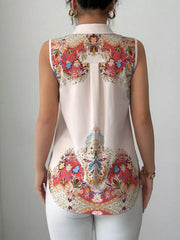 Sleeveless collared shirt in white with vibrant paisley print on back and yoke.