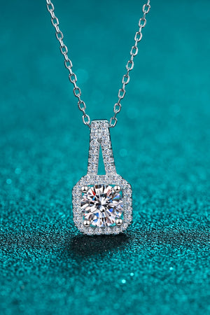 Silver cushion halo moissanite pendant necklace with a detailed chain.