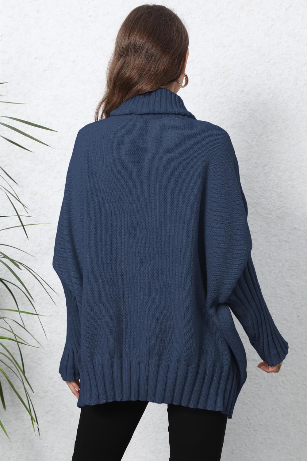 Dark Blue ribbed knit turtleneck sweater with batwing sleeves and ribbed cuffs and hem.