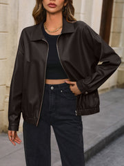 Brown faux leather bomber jacket with zip front and elastic cuffs.