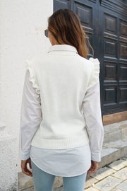 White diamond knit ruffle vest top with a mock neck, styled over a white collared shirt.