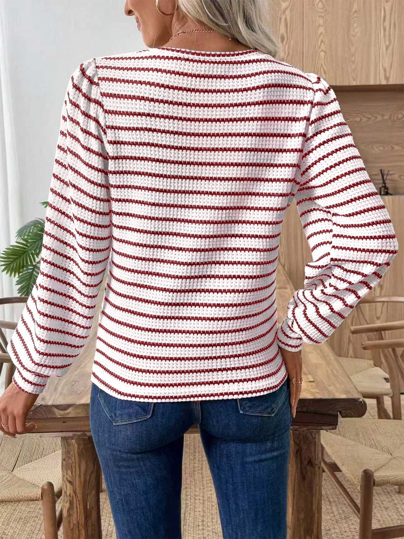 Textured knit long-sleeve t-shirt in white with scarlet stripes, featuring a waffle knit and puff sleeves.