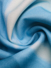Floral sweetheart midi dress fabric detail in aqua and blue tie-dye pattern.
