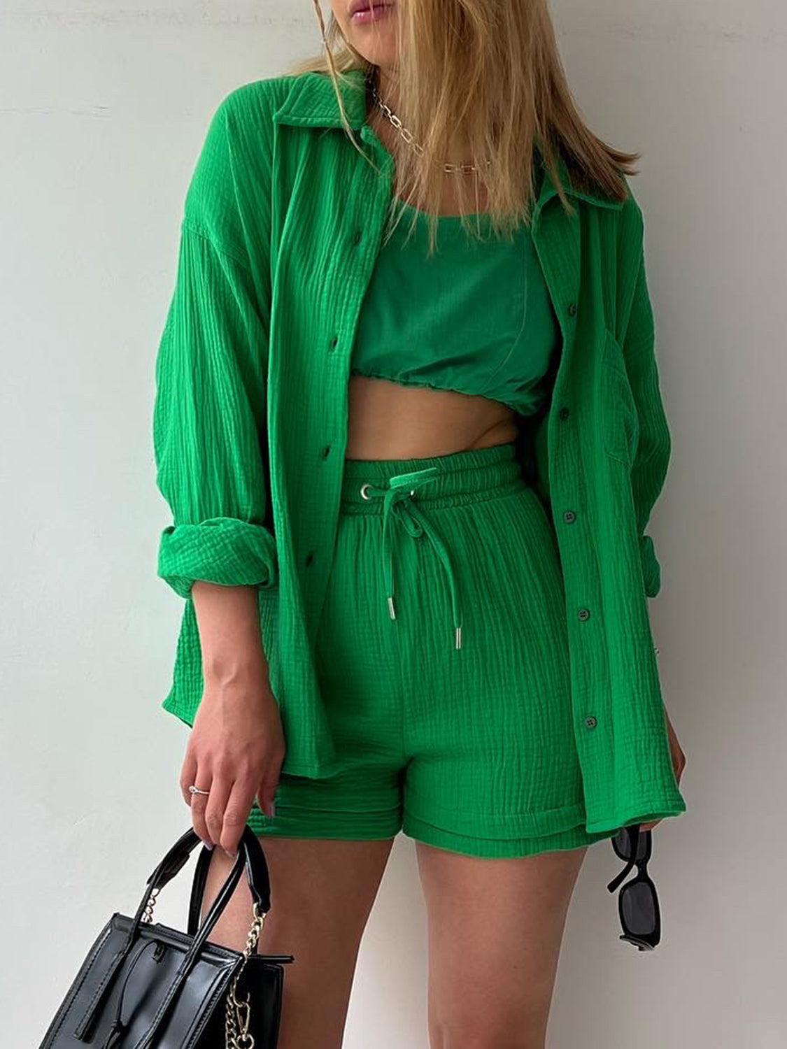 Green textured gauze shirt and shorts set with drawstring waist and button front.