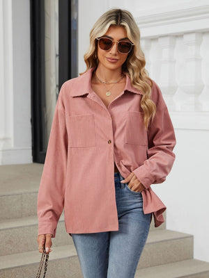 Dusty pink corduroy overshirt with button front and chest pockets.