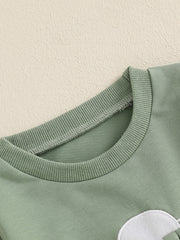 Green cotton baby outfit with bunny applique detail and ribbed crew neck.