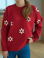 Burgundy knit sweater with embroidered white flowers and brown centers, crew neck, raglan sleeves.