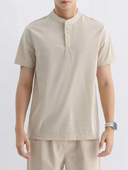 Apricot cotton t-shirt with short sleeves and a mandarin collar with button placket.
