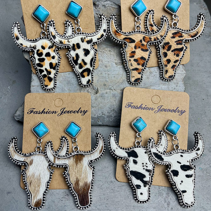 Cowhide bull head earrings with turquoise accents in leopard, cow, and spotted patterns.