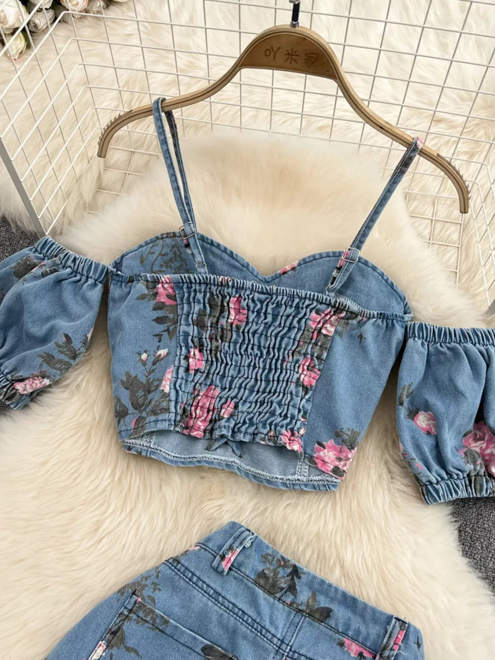 Denim sweetheart cami with floral print and smocked front, paired with matching denim shorts.