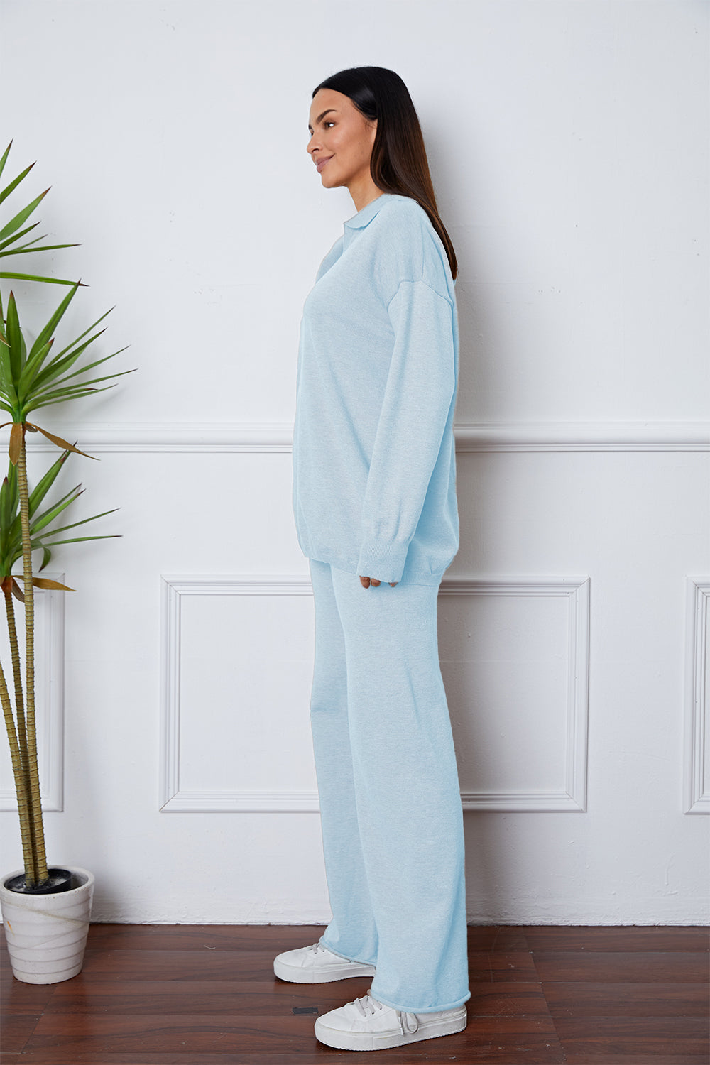 Relaxed Misty Blue knit polo co-ord set with collared neckline and long sleeves.