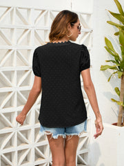 Black dotted swiss blouse with puff sleeves and lace trim neckline