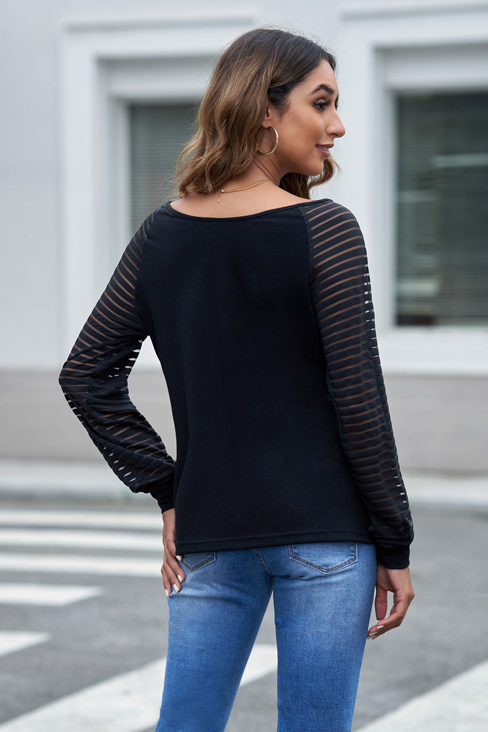 Black sheer stripe raglan sleeve top with scoop neck.