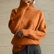 Textured diamond knit turtleneck pullover in caramel acrylic with ribbed cuffs and hem.