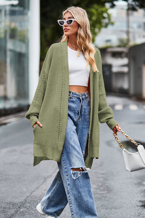 Sage open-knit longline cardigan with side slits and pockets, acrylic.