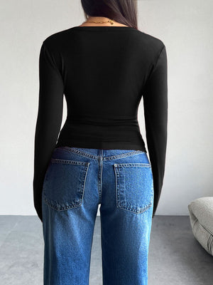 Black button-up cardigan with long sleeves, shown from the back.