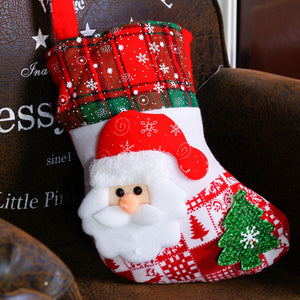 Festive red and white Christmas stocking with Santa face and green glitter tree detail.