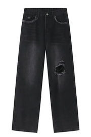 Distressed dark wide-leg denim jeans with raw edges and a ripped knee detail.
