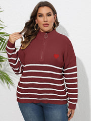 Burgundy striped ribbed knit sweater with mock neck, quarter zip, and red heart appliqué.