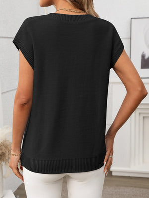 Black cable knit vest with V-neck and short sleeves, ribbed hem detail.