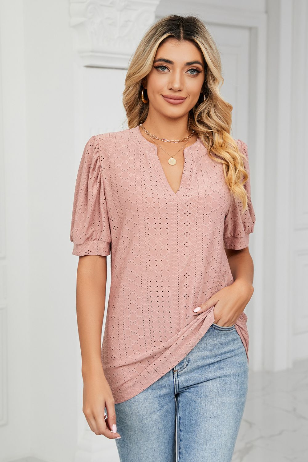 Perforated puff sleeve keyhole blouse in pink with eyelet details.