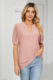 Perforated puff sleeve keyhole blouse in pink with eyelet details.