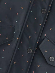 Toddler navy jacket with all-over heart and triangle print, featuring button details and pocket flaps.