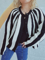 Bold stripe knit cardigan with button-up front and crew neck.