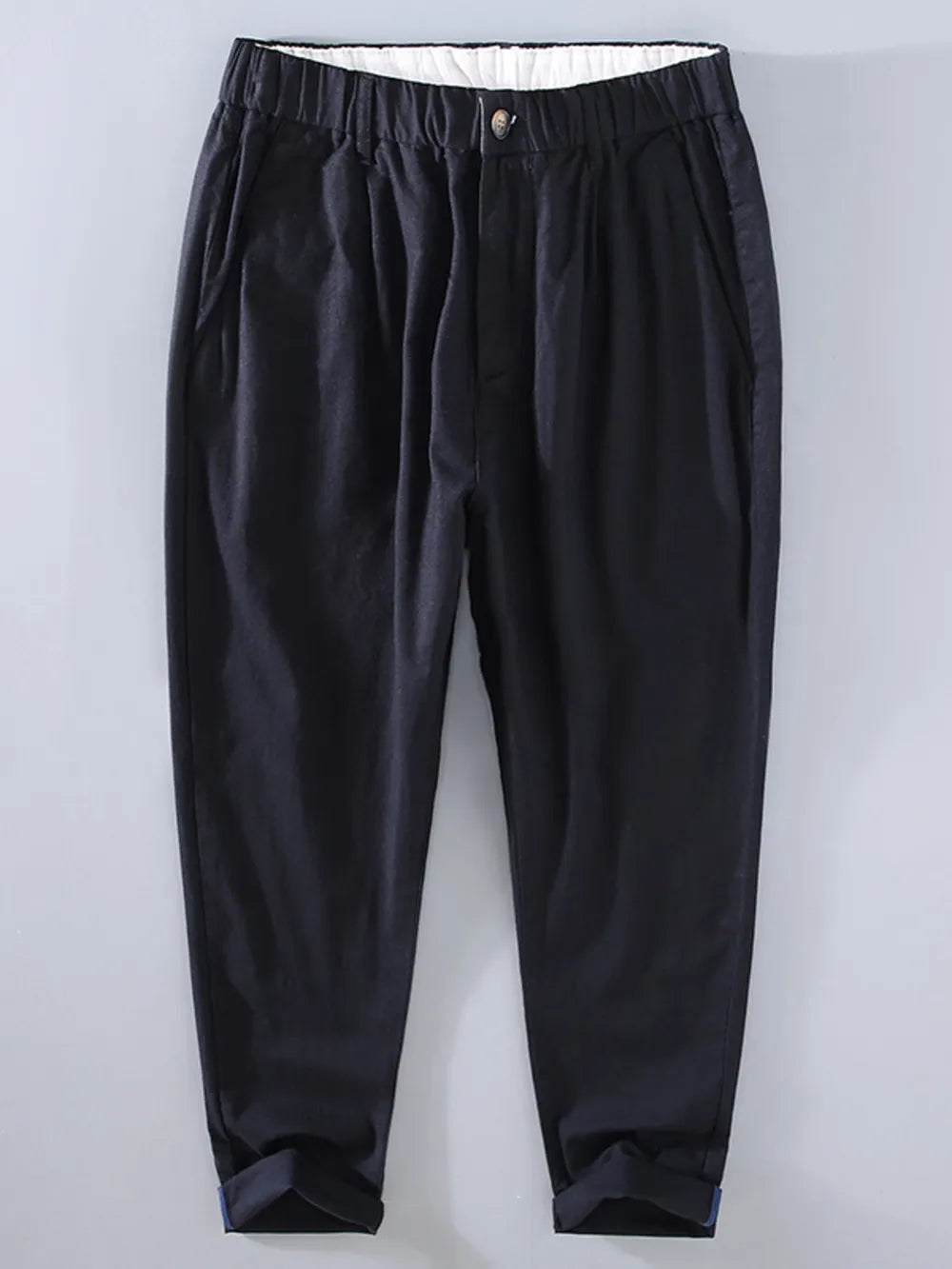 Men's black relaxed fit cropped sweatpants with elastic waist and cuffed hems.