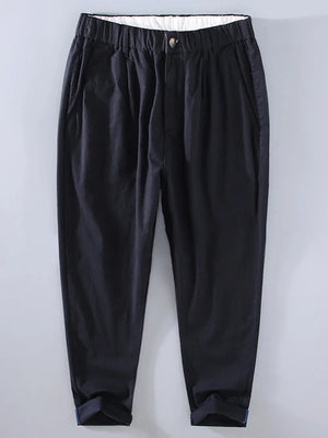 Men's black relaxed fit cropped sweatpants with elastic waist and cuffed hems.