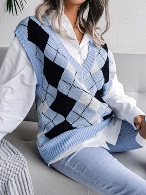 Argyle knit v-neck sweater vest in light blue, black, and white, styled over a white shirt.