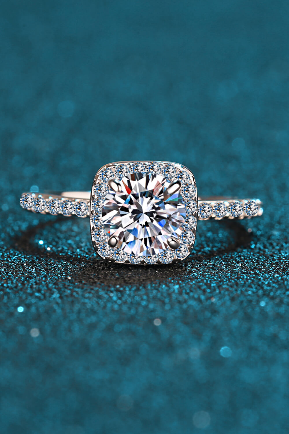 Silver cushion halo engagement ring with pave band