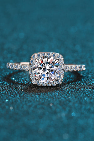 Silver cushion halo engagement ring with pave band