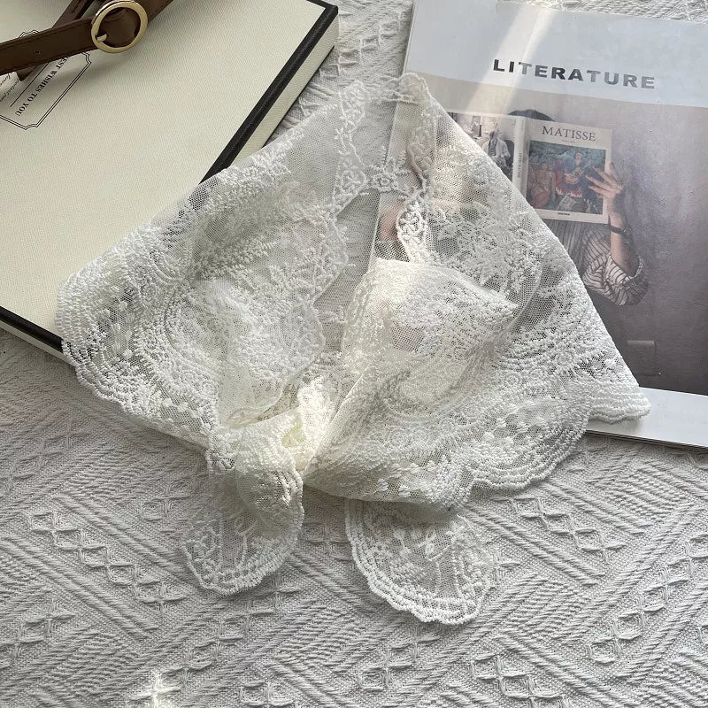 Delicate off-white floral lace scarf with scalloped edges.