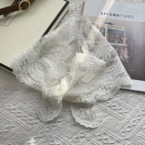 Delicate off-white floral lace scarf with scalloped edges.