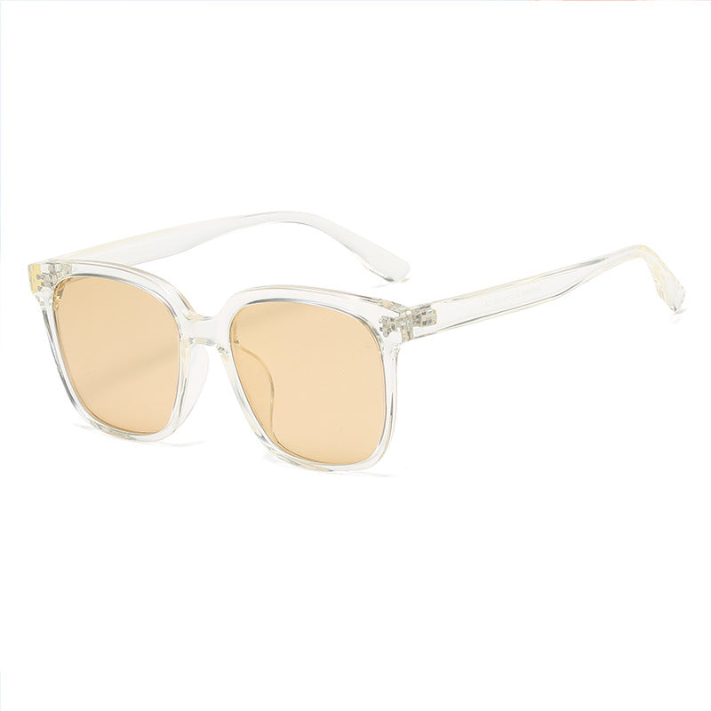 Chic square gradient tint sunglasses with clear frames and peach lenses.