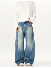 Relaxed fit washed cotton jeans in blue denim with a baggy cut and light fading.