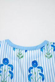 Floral stripe mini dress with blue floral print and light blue trim neckline.