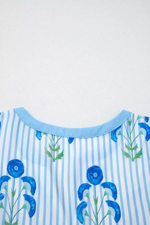 Floral stripe mini dress with blue floral print and light blue trim neckline.