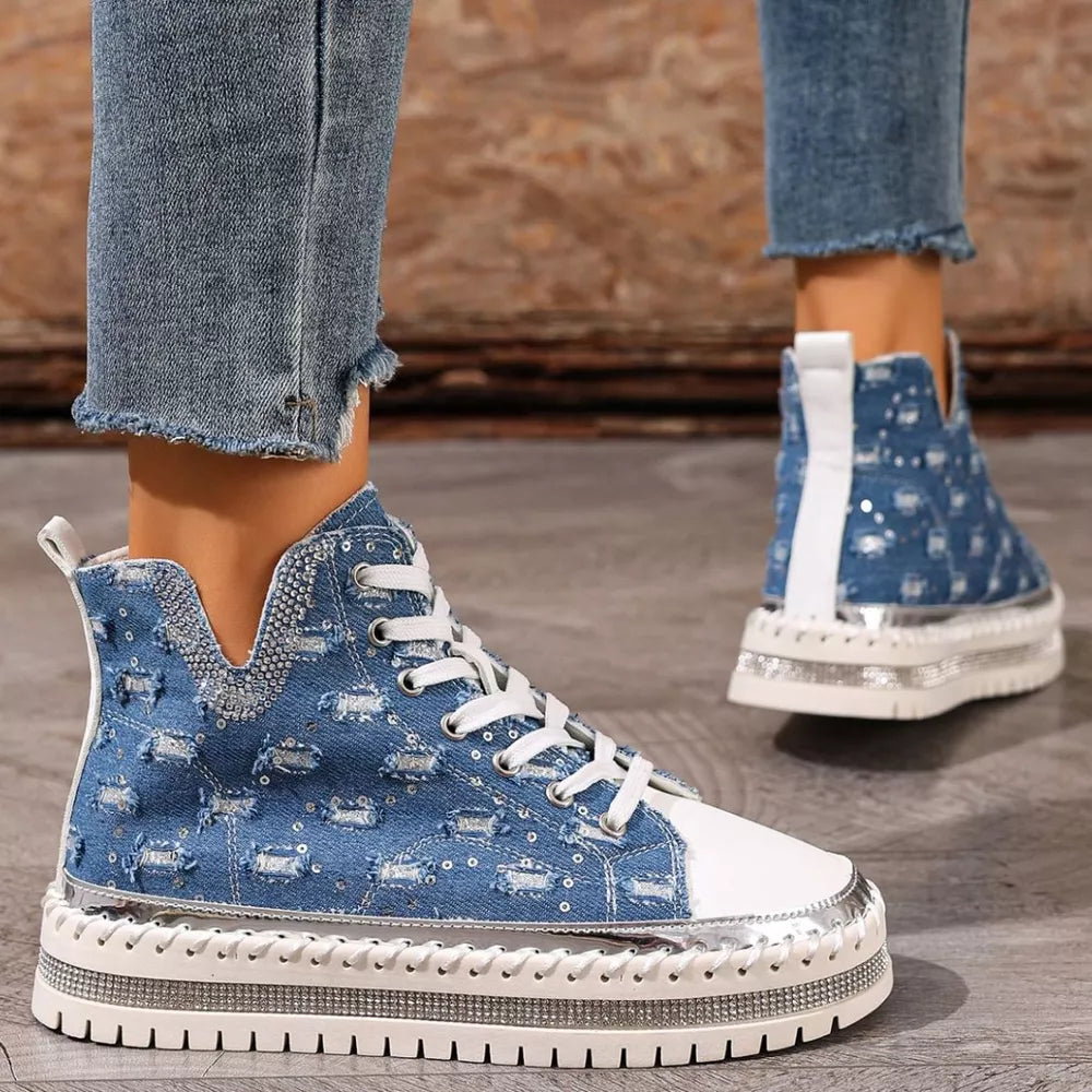 Blue denim high-top sneakers with rhinestone embellishments and a chunky sole.