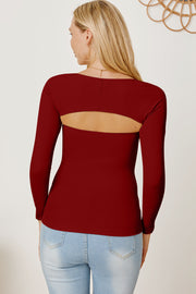 Burgundy long sleeve bodysuit with open back detail.